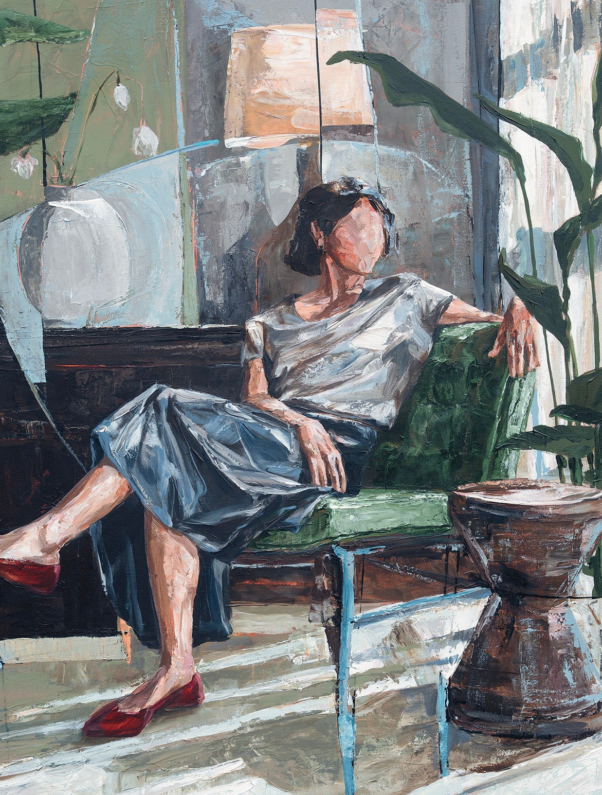 A painting depicting a woman sitting in a green armchair in a sunlit room, wearing a white top and a blue skirt with red shoes. The painting features textured brushstrokes and a complex background with furniture, plants, and a lamp.
